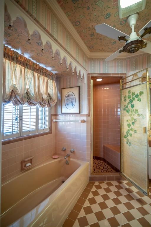 1617 Ranch Dr, Springdale, AR 72762 - bathroom with a bath, ceiling fan, crown molding, a stall shower, and tile patterned floors