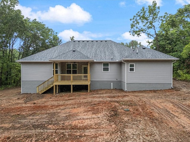7 Mcginnis Ln, Bella Vista, AR 72715 - back of property with roof with shingles and a deck