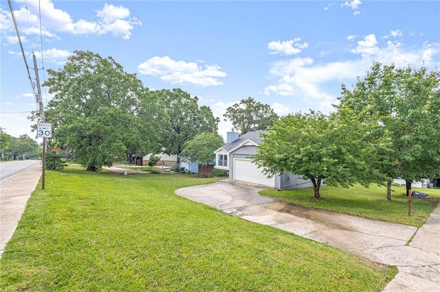 1137 E Township St, Fayetteville, AR 72703 - view of green lawn with concrete driveway