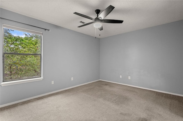 1137 E Township St, Fayetteville, AR 72703 - carpeted spare room with a ceiling fan, a textured ceiling, and baseboards