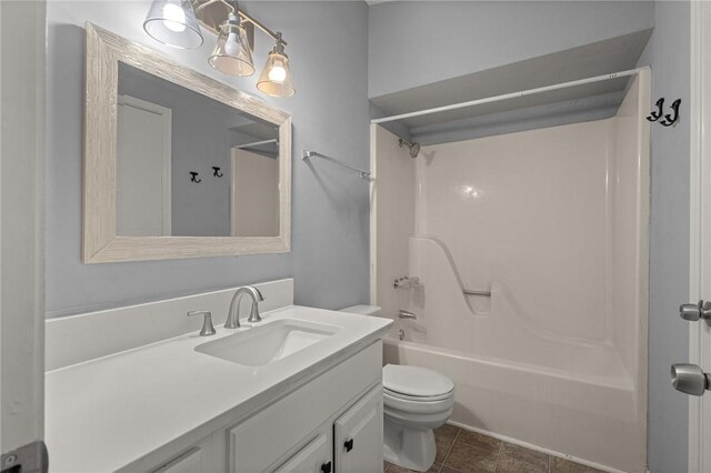 1137 E Township St, Fayetteville, AR 72703 - bathroom featuring toilet, vanity, and washtub / shower combination