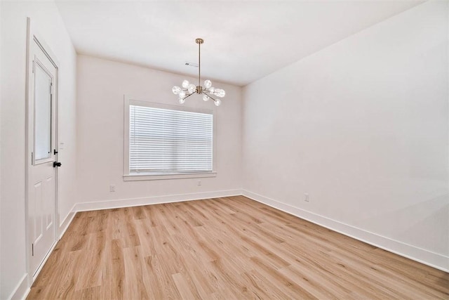 1 Consett Ln, Bella Vista, AR 72714 - empty room with light wood-type flooring, a chandelier, and baseboards
