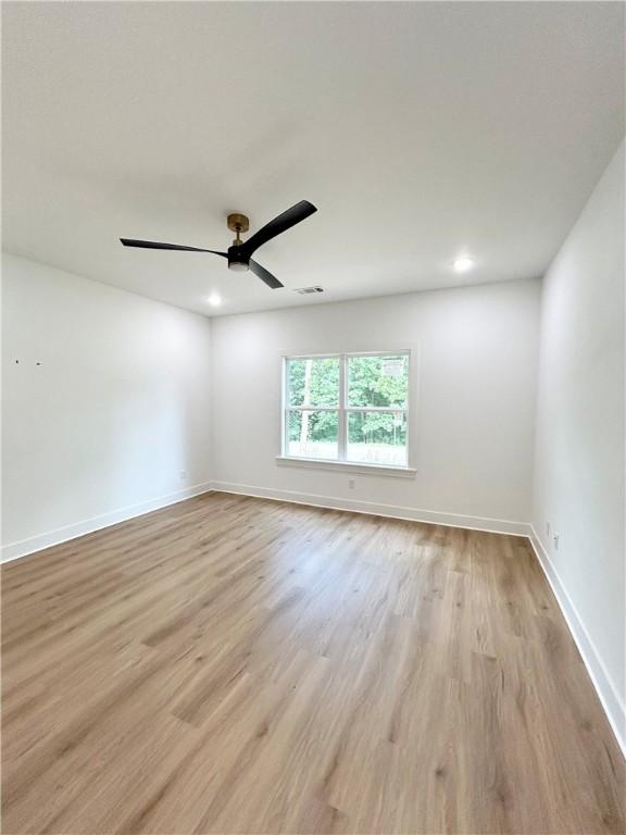 1 Consett Ln, Bella Vista, AR 72714 - unfurnished room with light wood-style flooring, ceiling fan, and recessed lighting
