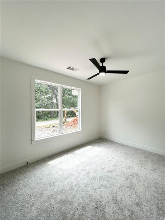 1 Consett Ln, Bella Vista, AR 72714 - carpeted spare room featuring a ceiling fan and baseboards