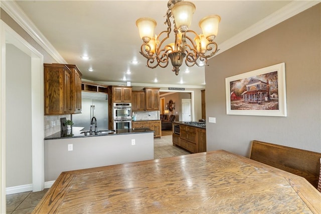 14453 Merritt Dr, Pea Ridge, AR 72751 - kitchen with stainless steel appliances, a sink, ornamental molding, backsplash, and dark countertops