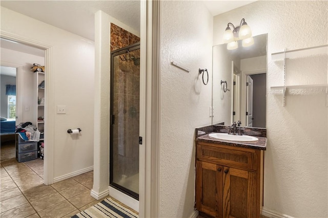 14453 Merritt Dr, Pea Ridge, AR 72751 - bathroom featuring a textured wall, tile patterned floors, a stall shower, and vanity
