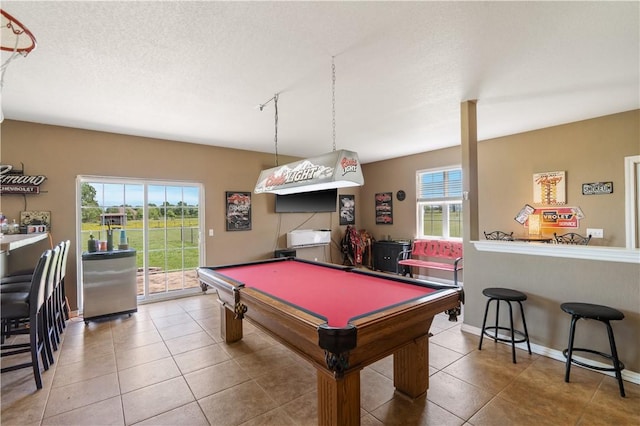 14453 Merritt Dr, Pea Ridge, AR 72751 - recreation room with tile patterned floors, billiards table, baseboards, and a textured ceiling