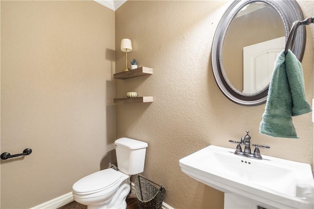 14453 Merritt Dr, Pea Ridge, AR 72751 - bathroom featuring a sink, toilet, and baseboards