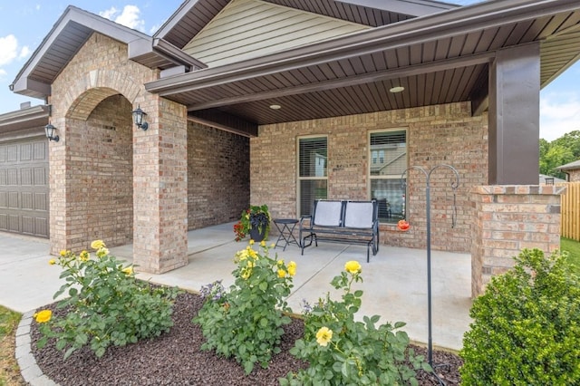 1431 Ari Ave, Centerton, AR 72719 - view of patio / terrace with an attached garage