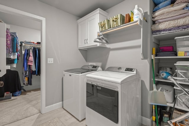 1431 Ari Ave, Centerton, AR 72719 - washroom featuring washer and dryer, cabinet space, baseboards, and light wood finished floors