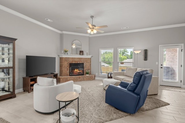 1431 Ari Ave, Centerton, AR 72719 - living area featuring crown molding, plenty of natural light, a brick fireplace, a ceiling fan, and baseboards