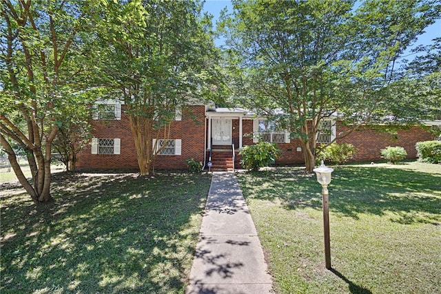 711 W 18th Ter, Russellville, AR 72801 - tri-level home with a front lawn and brick siding