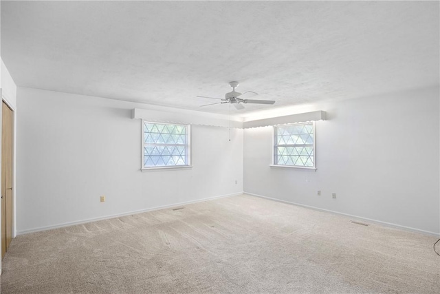 711 W 18th Ter, Russellville, AR 72801 - unfurnished bedroom with multiple windows, carpet flooring, and baseboards