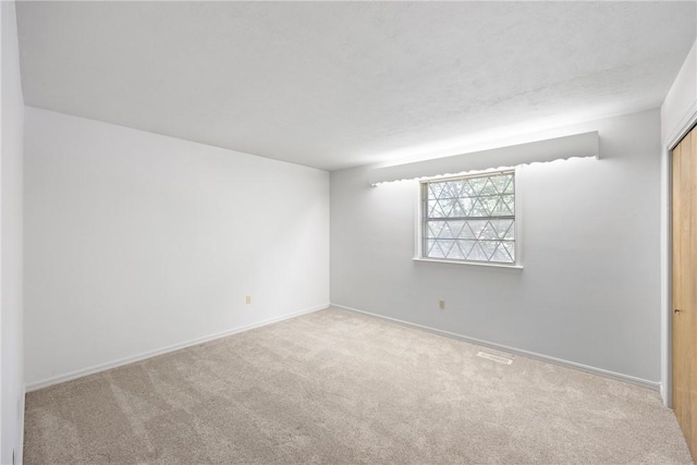 711 W 18th Ter, Russellville, AR 72801 - carpeted spare room featuring baseboards