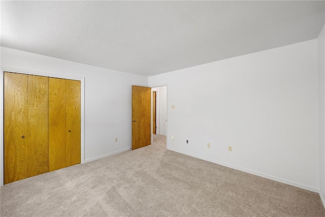 711 W 18th Ter, Russellville, AR 72801 - unfurnished bedroom featuring carpet floors and baseboards