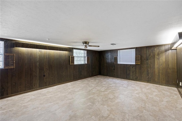 711 W 18th Ter, Russellville, AR 72801 - basement with wood walls and ceiling fan
