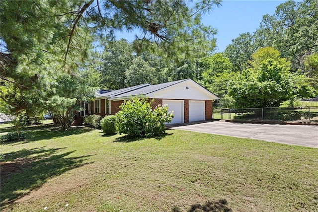 711 W 18th Ter, Russellville, AR 72801 - view of side of home with driveway, a garage, and brick siding