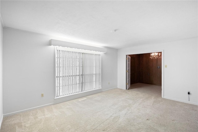 711 W 18th Ter, Russellville, AR 72801 - carpeted spare room with baseboards and a chandelier