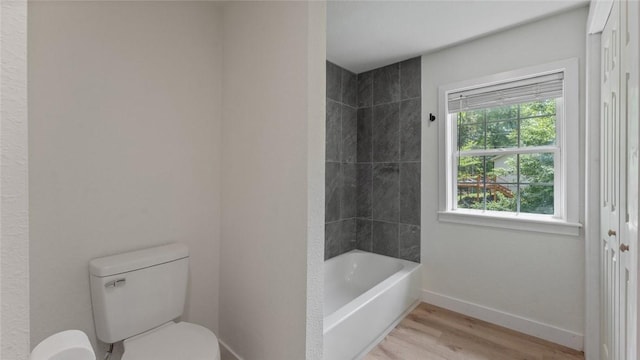 1580 Jones Ln, Pea Ridge, AR 72751 - full bath with toilet, wood finished floors, baseboards, and shower / bath combination