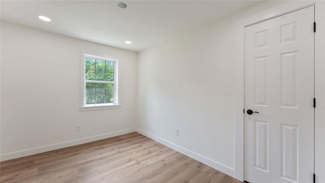 1580 Jones Ln, Pea Ridge, AR 72751 - spare room featuring light wood finished floors, baseboards, and recessed lighting