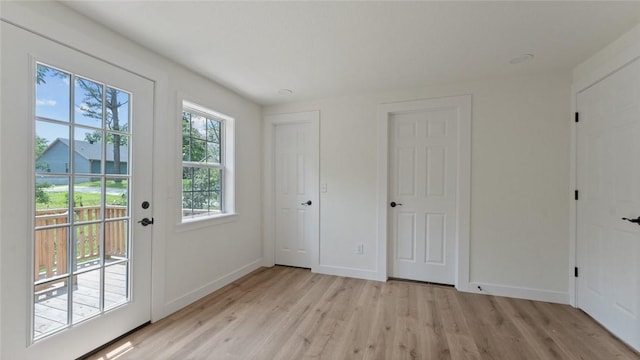1580 Jones Ln, Pea Ridge, AR 72751 - doorway to outside with light wood-style floors and baseboards