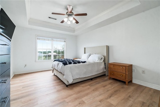 904 S Lafayette St, Rogers, AR 72758 - bedroom with a raised ceiling, light wood finished floors, crown molding, baseboards, and a ceiling fan