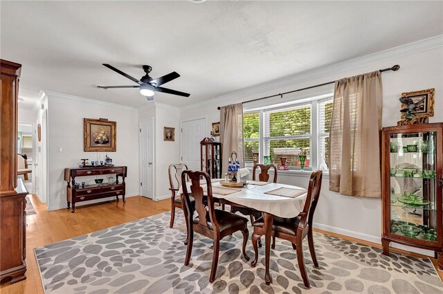 1330 S Baldwin Ave, Fayetteville, AR 72701 - dining area with ornamental molding, light wood-style flooring, ceiling fan, and baseboards