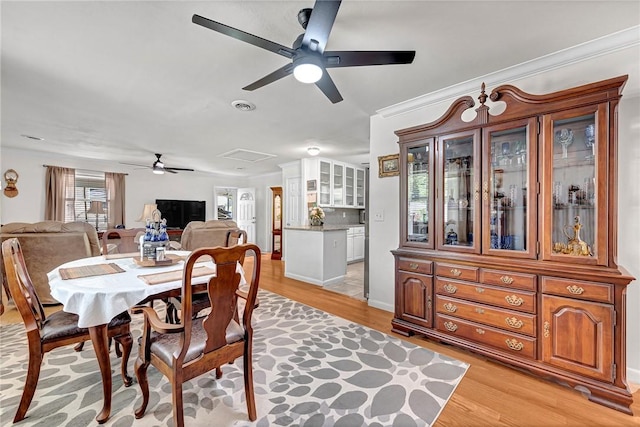 1330 S Baldwin Ave, Fayetteville, AR 72701 - dining area featuring a ceiling fan, light wood-style flooring, and crown molding