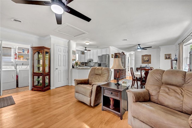 1330 S Baldwin Ave, Fayetteville, AR 72701 - living area featuring ceiling fan, independent washer and dryer, light wood-style flooring, crown molding, and attic access