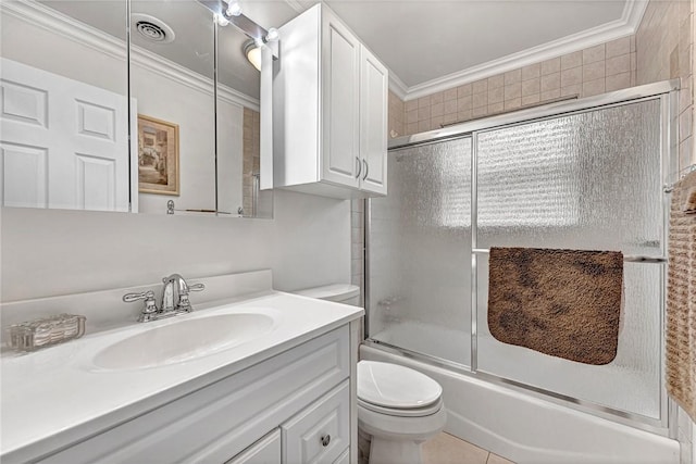 1330 S Baldwin Ave, Fayetteville, AR 72701 - full bathroom featuring ornamental molding, toilet, vanity, and bath / shower combo with glass door