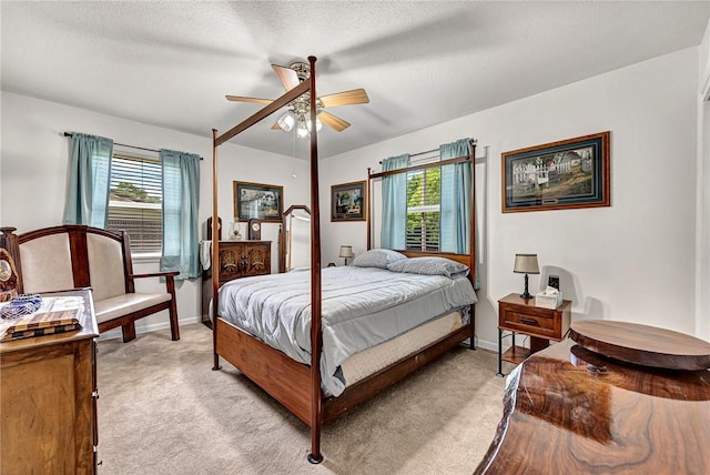 1330 S Baldwin Ave, Fayetteville, AR 72701 - bedroom featuring multiple windows, light carpet, and baseboards