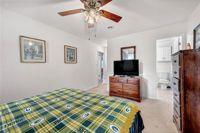1330 S Baldwin Ave, Fayetteville, AR 72701 - bedroom with light colored carpet, baseboards, connected bathroom, and ceiling fan