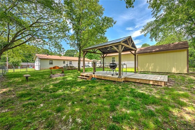 1330 S Baldwin Ave, Fayetteville, AR 72701 - view of yard featuring a gazebo, a wooden deck, and a fire pit