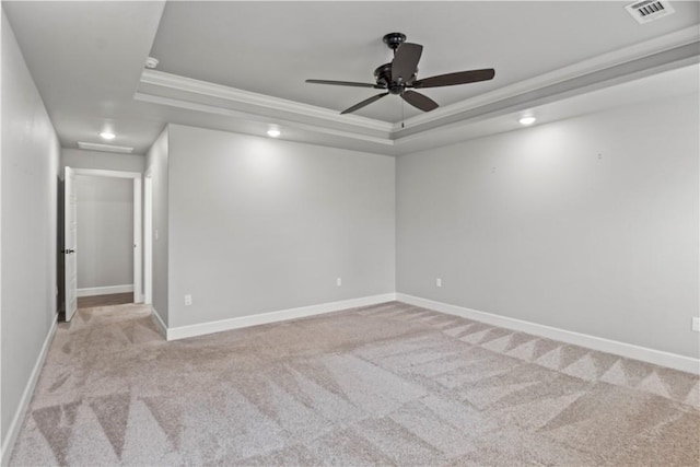 1440 Amber Way, Centerton, AR 72719 - spare room with a tray ceiling, crown molding, light carpet, ceiling fan, and baseboards