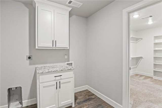 1440 Amber Way, Centerton, AR 72719 - laundry area with hookup for an electric dryer, baseboards, cabinet space, and dark wood-style floors