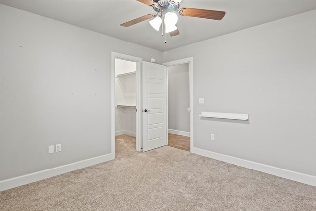 1440 Amber Way, Centerton, AR 72719 - unfurnished bedroom featuring carpet, a spacious closet, baseboards, and a closet
