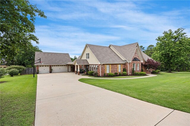 306 Osage Ct, Russellville, AR 72802 - view of front of property with concrete driveway, a garage, and brick siding