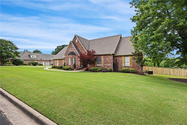 306 Osage Ct, Russellville, AR 72802 - view of front of house with brick siding, a shingled roof, and central AC