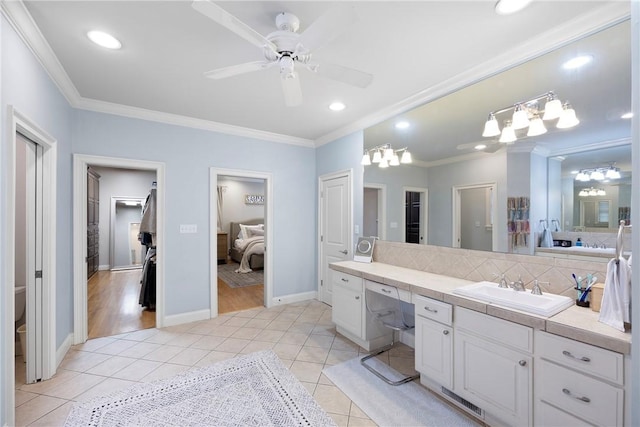 306 Osage Ct, Russellville, AR 72802 - ensuite bathroom with vanity, tile patterned floors, ornamental molding, ceiling fan, and recessed lighting