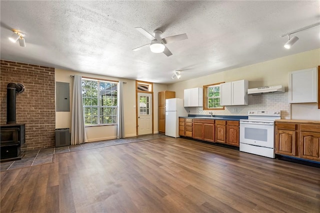 19051 Pinecrest Ln, Rogers, AR 72756 - kitchen with white appliances, under cabinet range hood, a textured ceiling, electric panel, and dark wood-style flooring