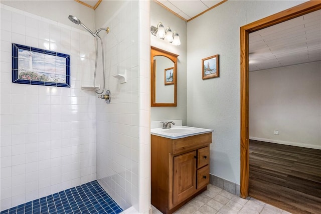 19051 Pinecrest Ln, Rogers, AR 72756 - bathroom featuring tiled shower, vanity, tile patterned flooring, and crown molding