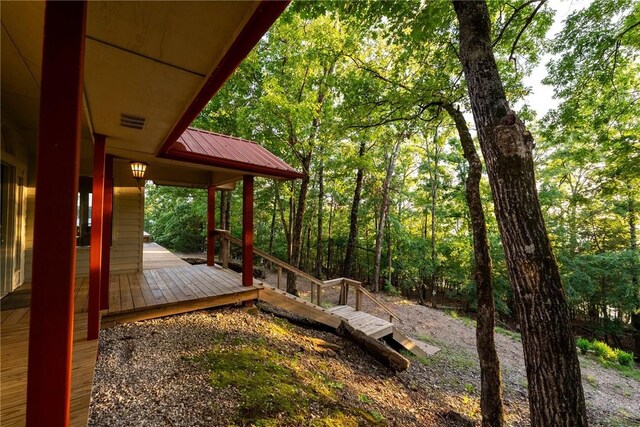 9151 Bay Ridge Ln, Garfield, AR 72732 - view of yard with a wooden deck and a forest view
