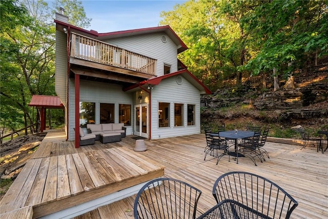 9151 Bay Ridge Ln, Garfield, AR 72732 - deck featuring outdoor dining space and an outdoor hangout area