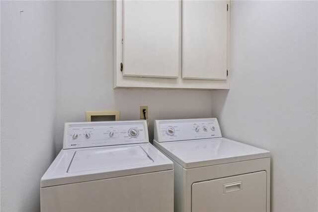 9151 Bay Ridge Ln, Garfield, AR 72732 - laundry room with independent washer and dryer and cabinet space