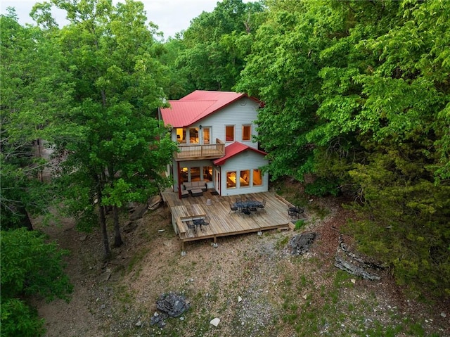 9151 Bay Ridge Ln, Garfield, AR 72732 - rear view of house with a balcony, a deck, and a view of trees