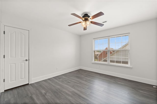 600 Rocky Xing, Fayetteville, AR 72704 - unfurnished room with baseboards, dark wood finished floors, and ceiling fan