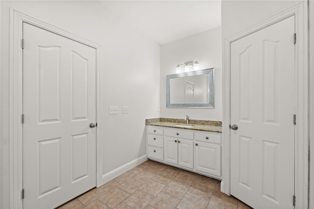 600 Rocky Xing, Fayetteville, AR 72704 - bathroom with vanity, baseboards, and tile patterned flooring