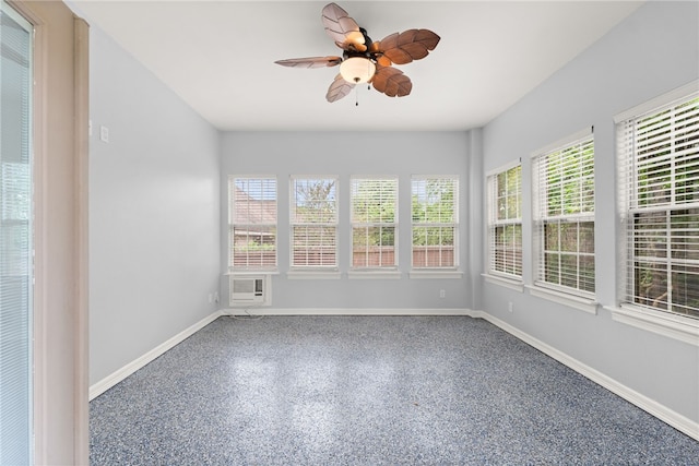 600 Rocky Xing, Fayetteville, AR 72704 - unfurnished sunroom featuring baseboards and speckled floor