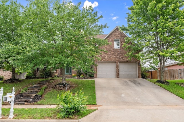 600 Rocky Xing, Fayetteville, AR 72704 - view of front of property featuring brick siding, concrete driveway, and a garage