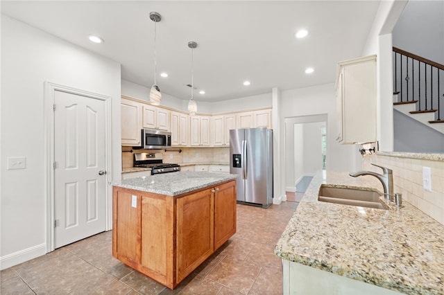 600 Rocky Xing, Fayetteville, AR 72704 - kitchen featuring stainless steel appliances, backsplash, a sink, light stone counters, and recessed lighting